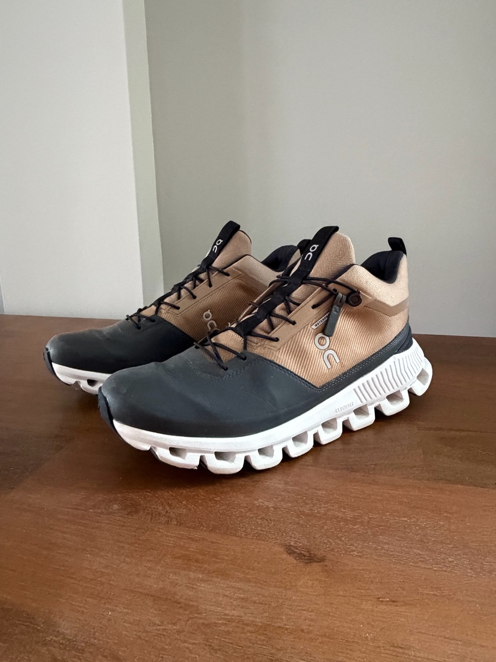 On Running Women’s Black and Tan CloudTec Sneakers